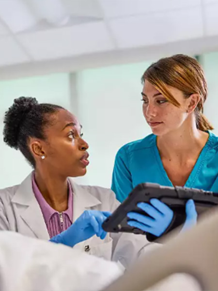 Healthcare professional speaking with a patient